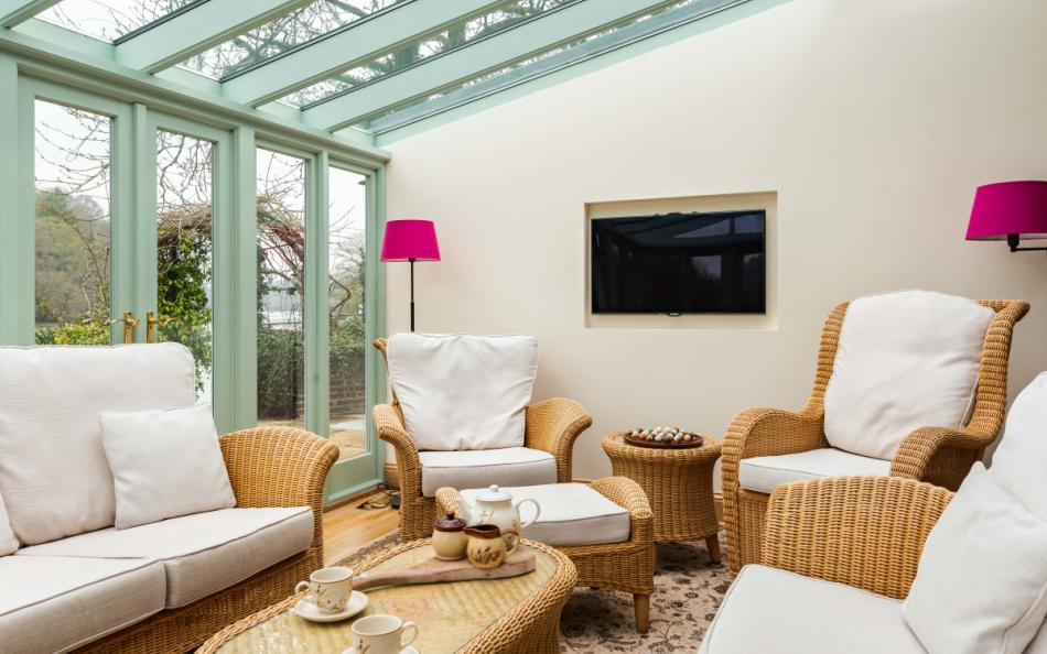 Relax in comfort in the conservatory at Perchwood Shippon