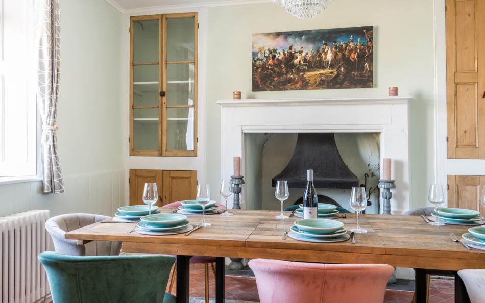 Elegant separate dining room with feature fireplace at Halcyon House