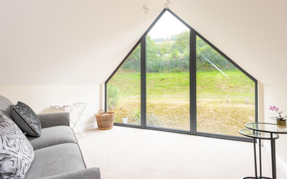 Relax in the upstairs snug with views over the garden at Acacia House 