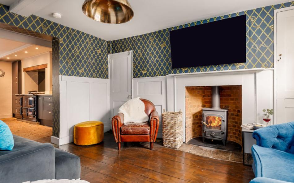 lounge with woodburner at Saddlers Cottage