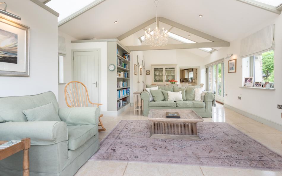 Wonderfully designed sunroom with pitched ceiling at Bow Bridge House 