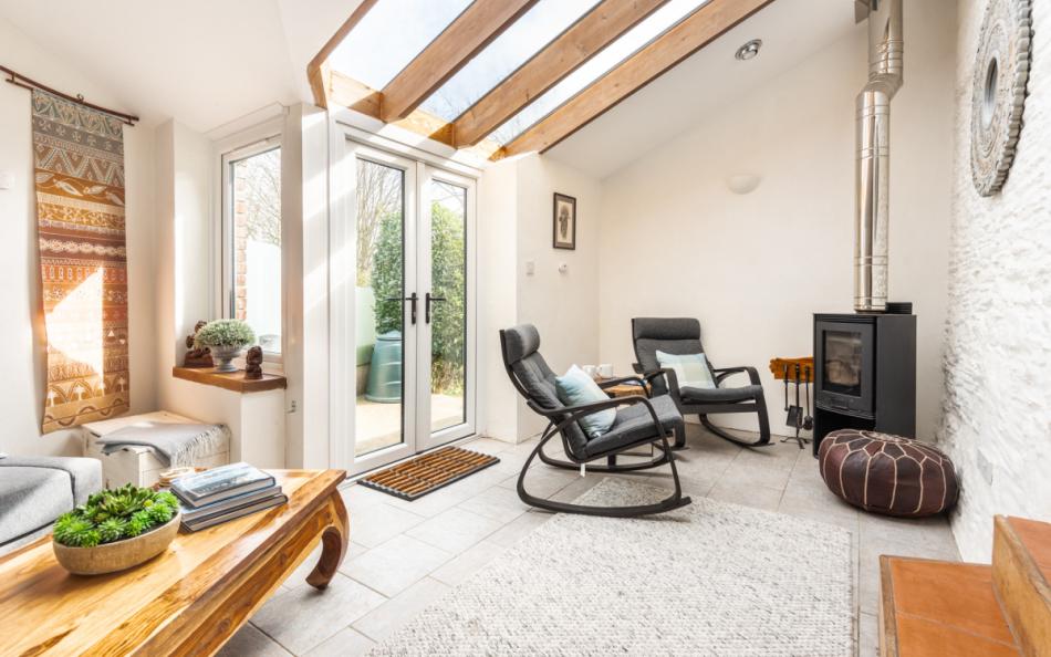 Lovely reading space with a log burner at Little Cumery