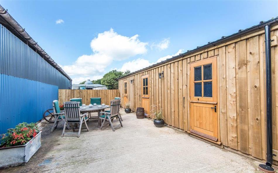 The enclosed courtyard and games room at Berry's Barn 