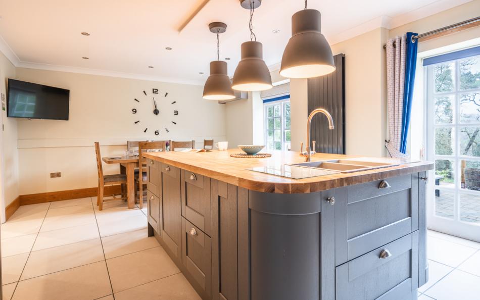 Kitchen island with breakfast bar at Rhododendron House