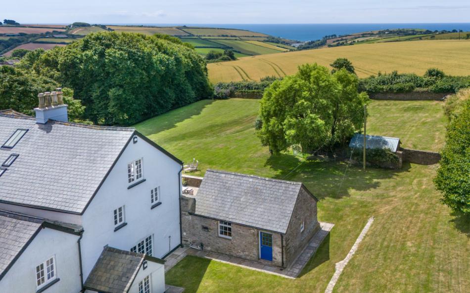 Back aerial view of the house at Bigbury Court Farmhouse