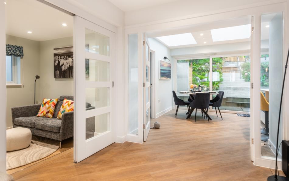 The snug, and a peek through to the kitchen with breakfast table at Agincourt