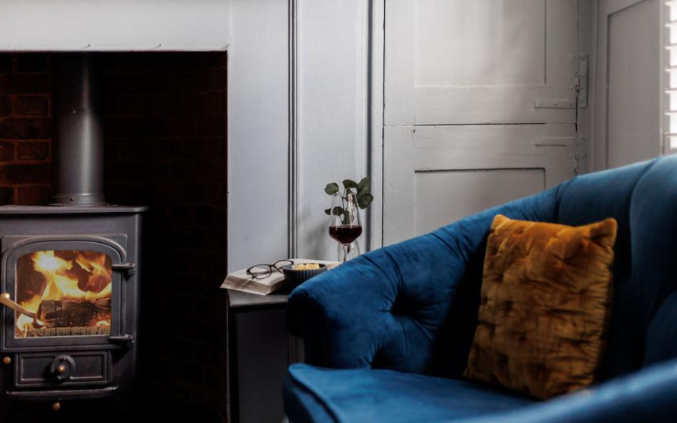 chair by fire at Saddlers Cottage