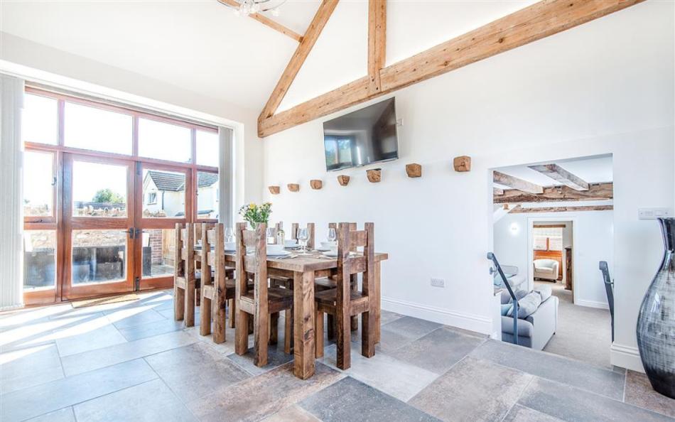 A huge kitchen diner with 55 inch Flat scrren TV at Berry's Barn 