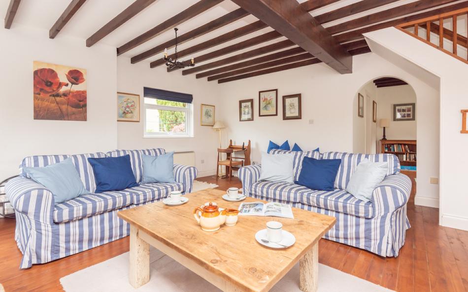 The cosy comfortable lounge with log burner at Orchard View 