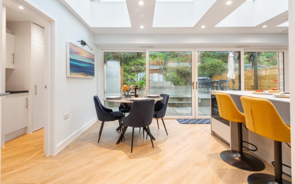 The breakfast bar and breakfast table, overlooking the rear terrace at Agincourt