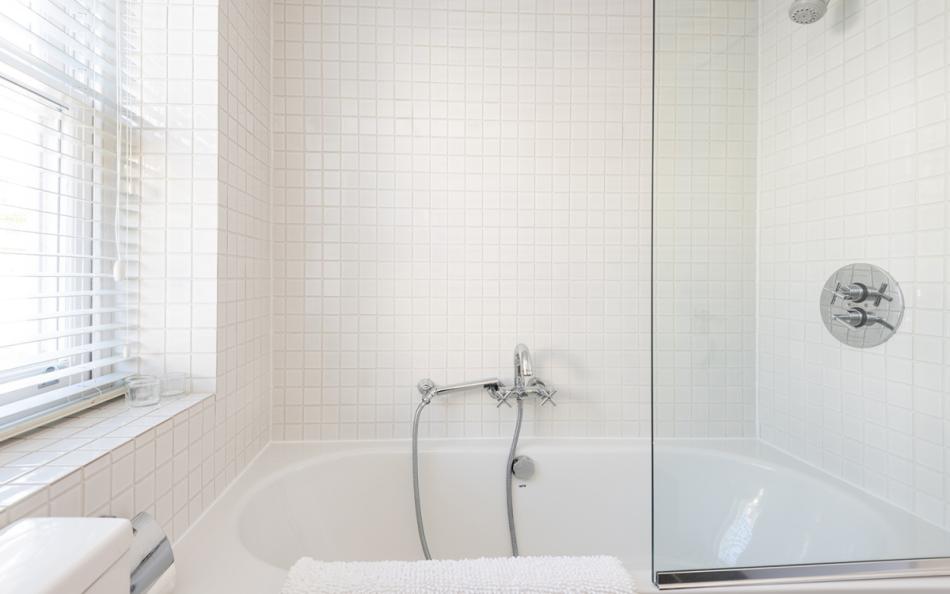 Master bedroom ensuite with bath and overhead shower at 11 Combehaven 