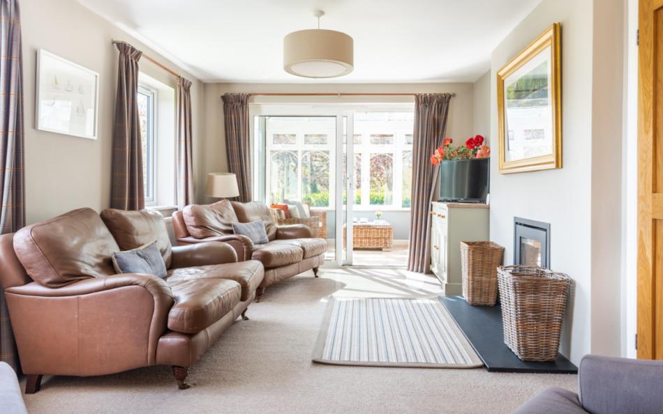 The cosy lounge with log burner at Clover Cottage