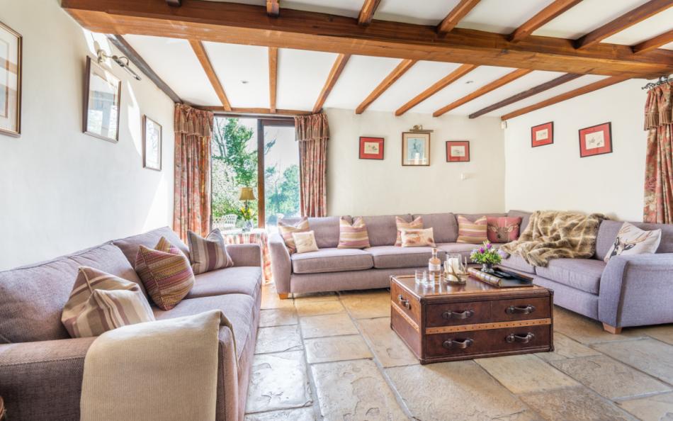 Relaxing sitting room with log burner at Auton Court