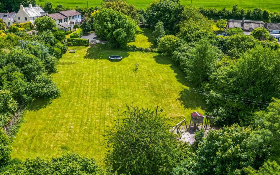 The paddock, with trampoline and play area at Orchard View 
