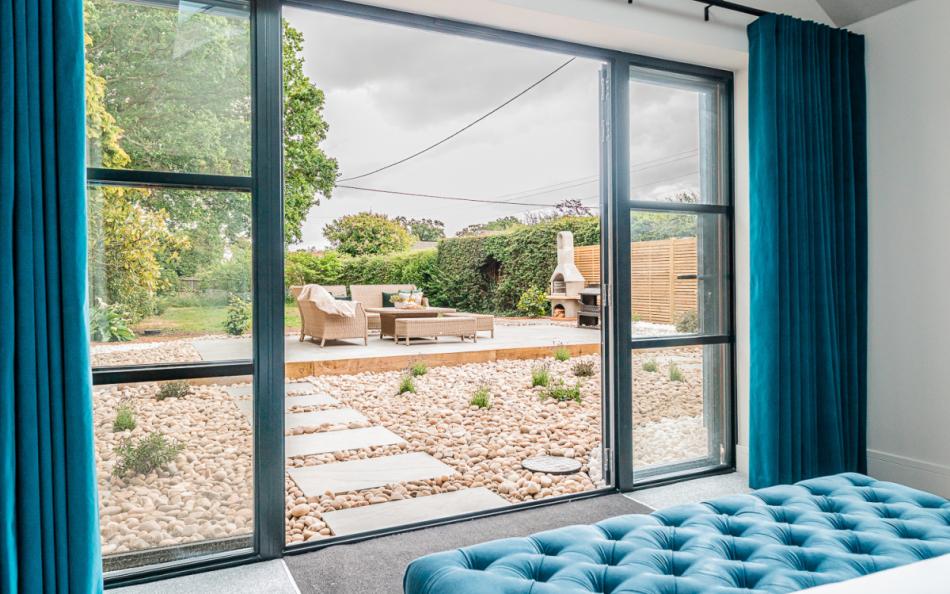 blue bedroom to garden at Fiddlesticks Cottage