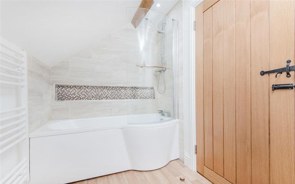 The family bathroom with shower over bath at Berry's Barn 