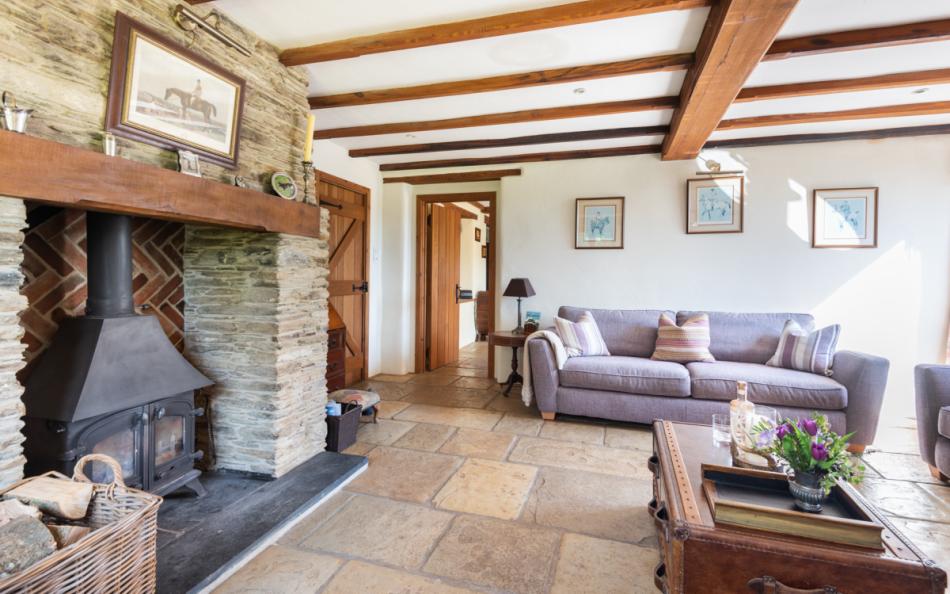 Enjoy the sitting room with log burner at Auton Court