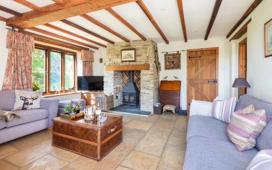 Log burner with cosy seating at Auton Court