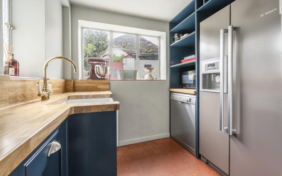 kitchen with american fridge freezer at Saddlers Cottage
