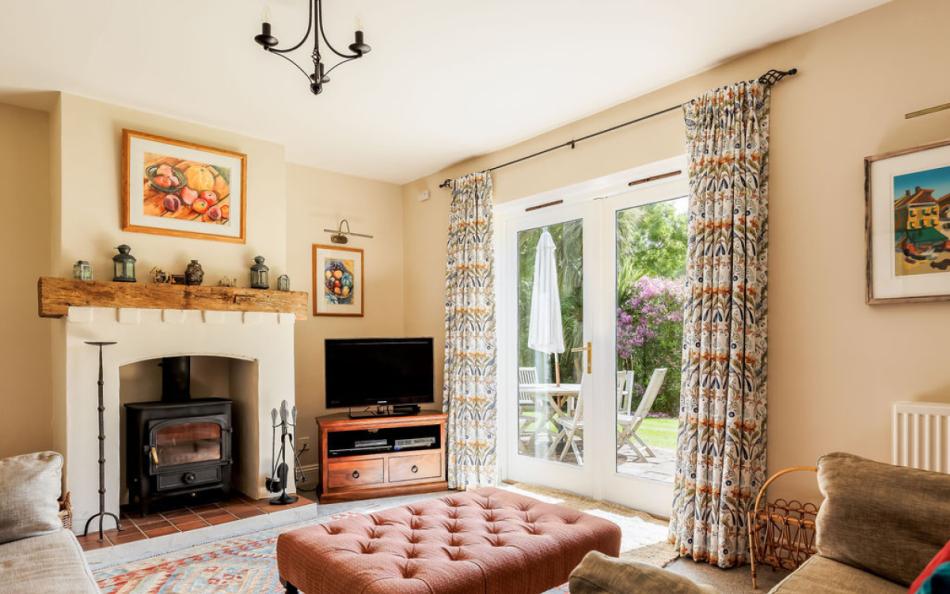 lounge with woodburner at Old Farm Cottage