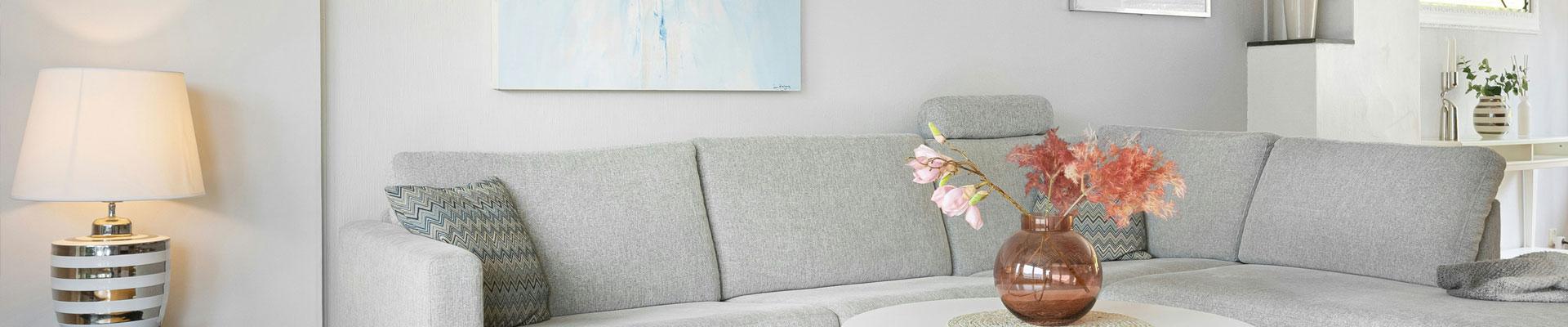 Relax in style in this large and bright holiday cottage in Denbighshire which has a lovely seating area to admire the art on display