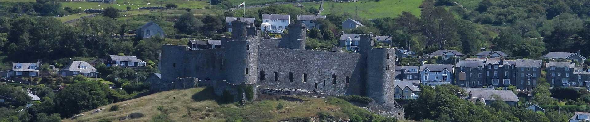 Large holiday cottages near to Mount Snowdon and overlooked by a historic castle available in Harlech, Gwynedd