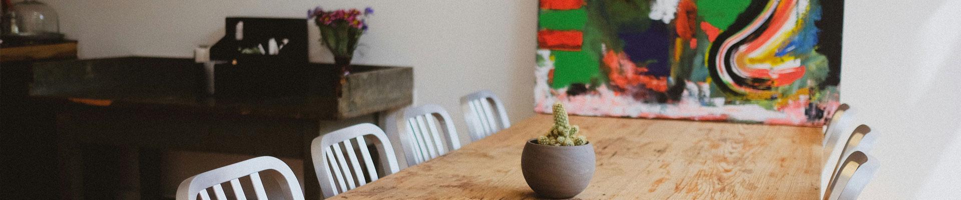 Large holiday cottages available in Porthmadog, Gwynedd with beautiful and spacious dining areas surrounded with fine art